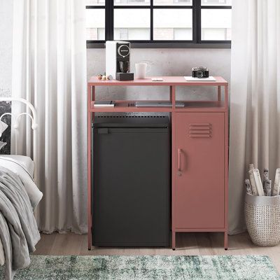 a pink and black cabinet next to a window