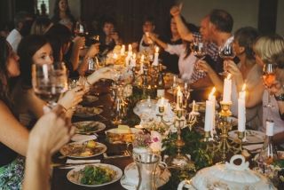 a group of people sitting around a dinner table