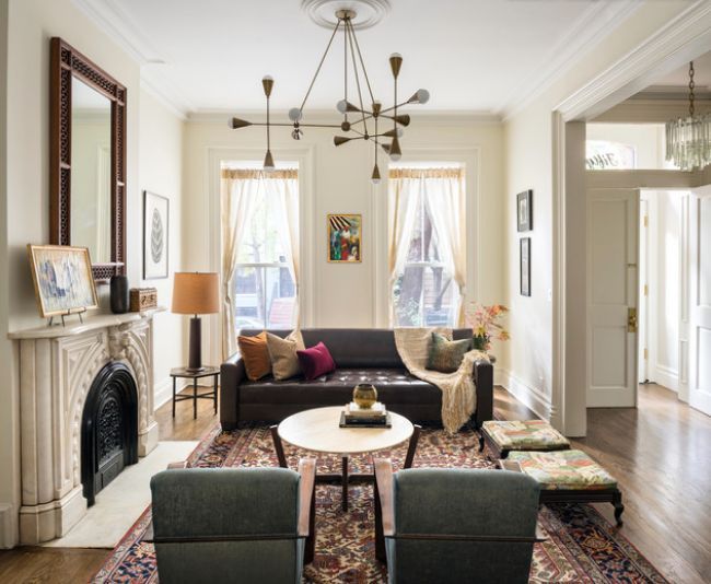 a living room filled with furniture and a fire place