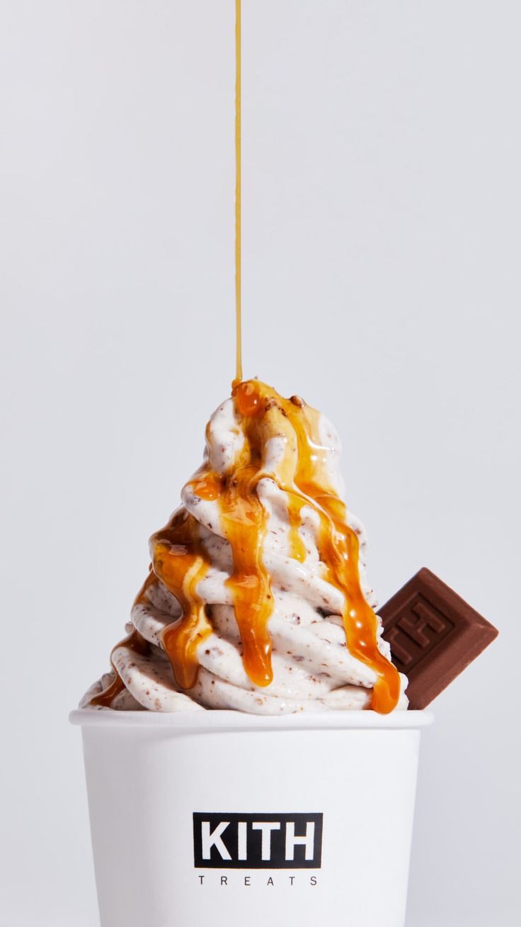 an ice cream sundae with caramel drizzle on top