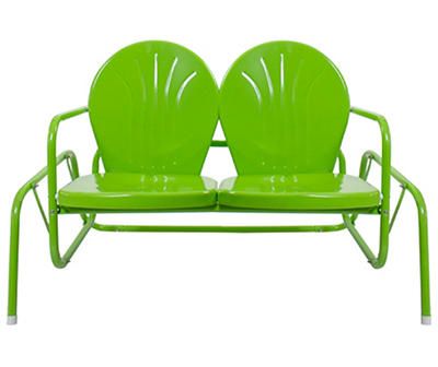 two green chairs sitting next to each other