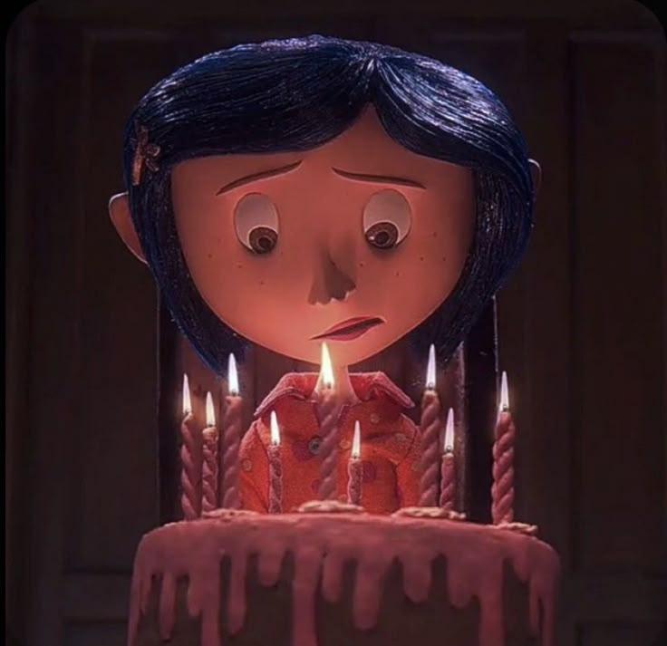 a girl with blue hair is blowing out candles on a birthday cake