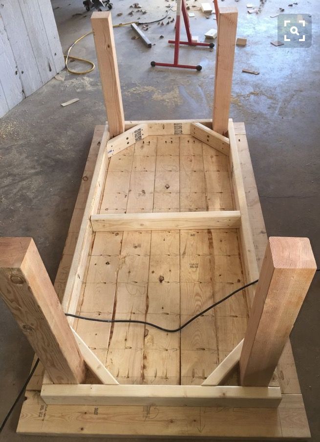 a wooden bench being built in a garage