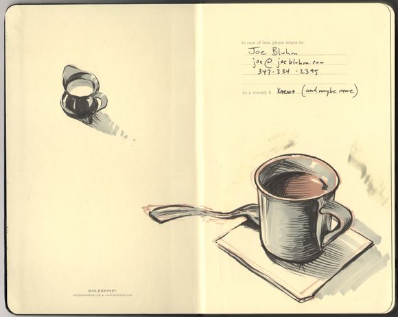 an open book with a drawing of a coffee cup and spoon