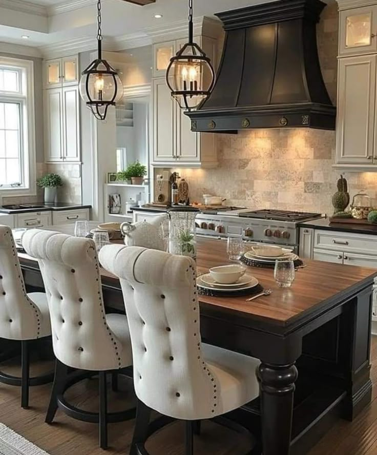 a large kitchen island with chairs around it