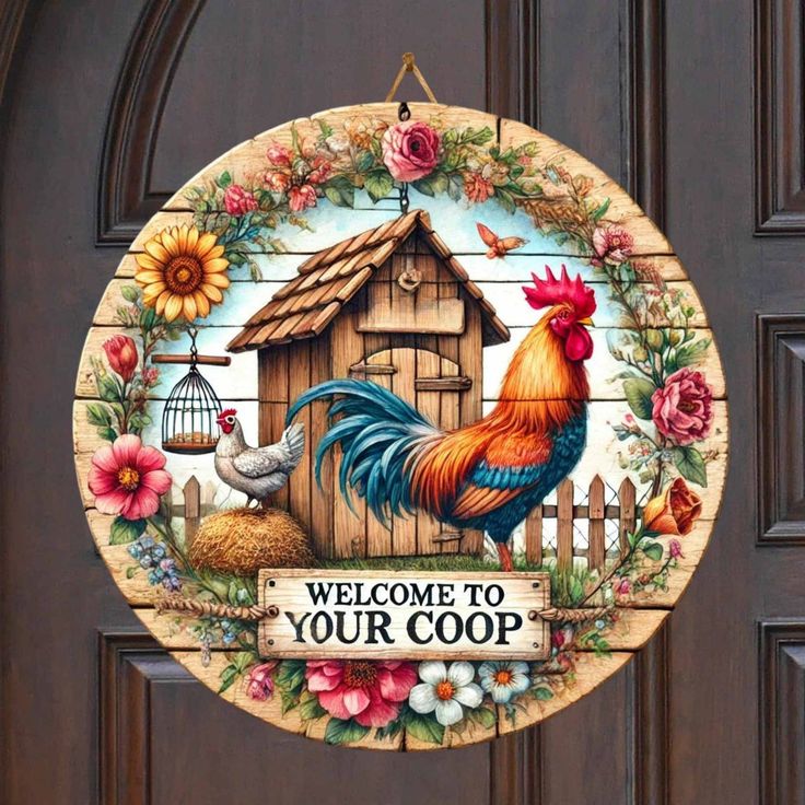 a welcome sign is hanging on the front door to a house with flowers and a bird