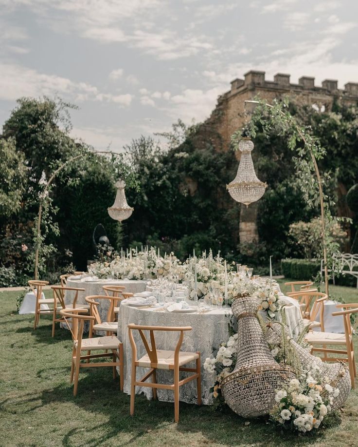 an outdoor table set up for a wedding reception