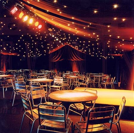 an empty banquet hall with tables and chairs