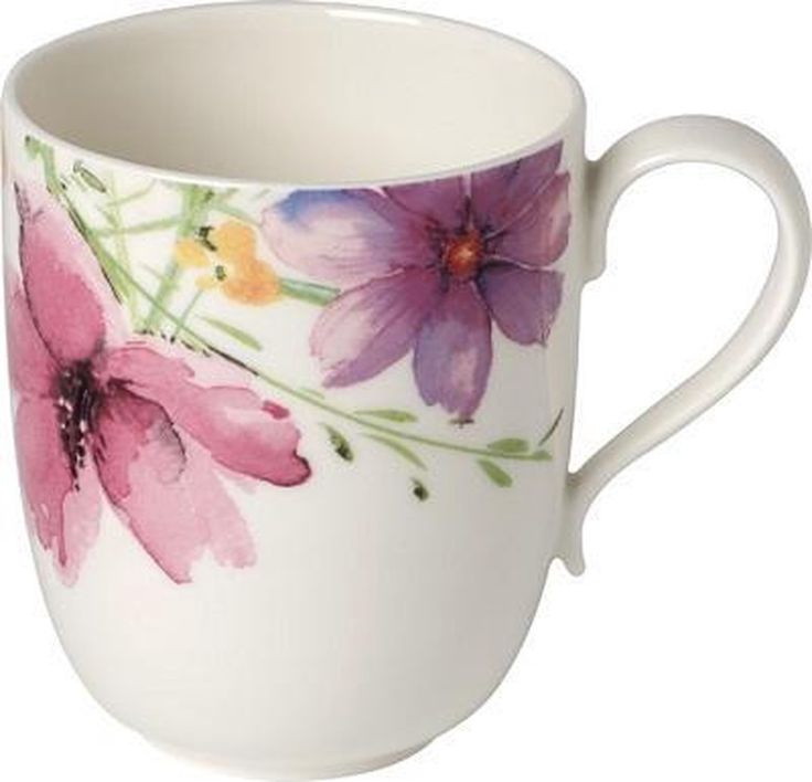 a white coffee cup with purple flowers painted on it