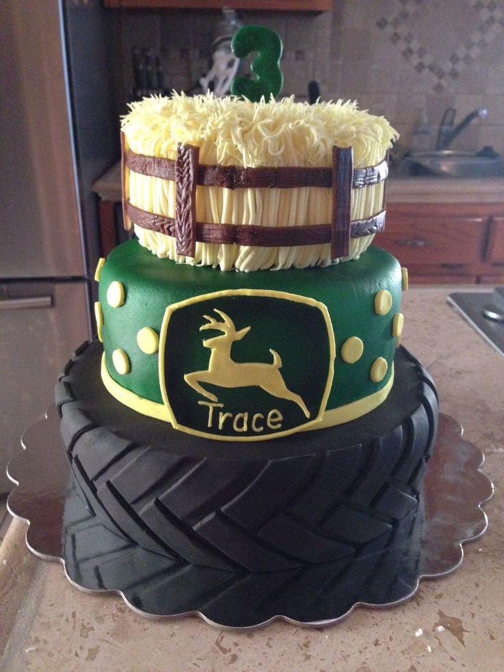 a cake made to look like a tractor tire with a deer on the front and side