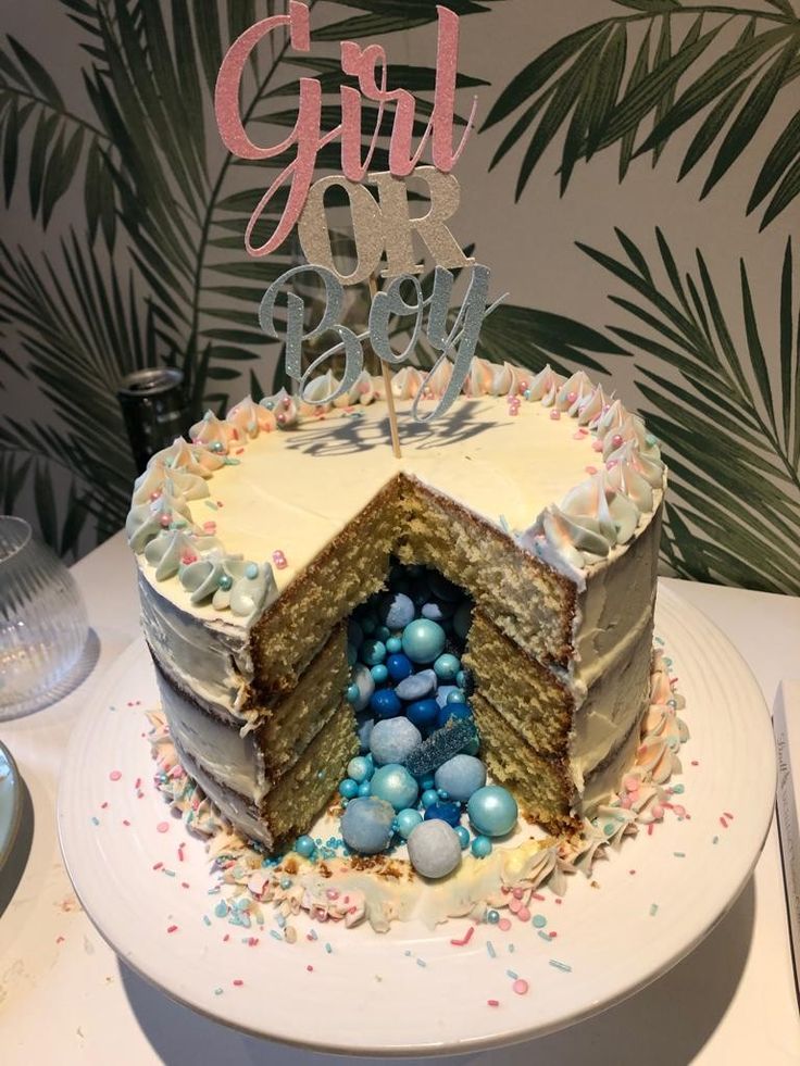 a cake with white frosting and blue decorations