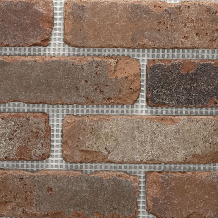 a brick wall with several different colored bricks