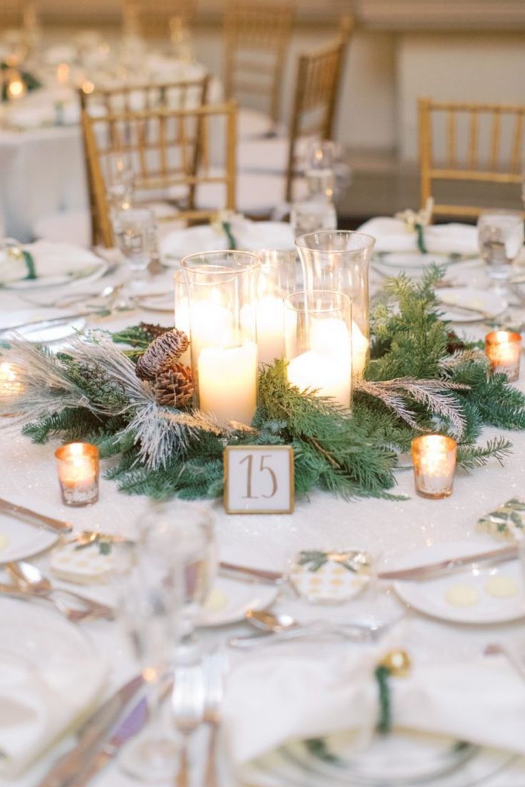 the table is set with candles and place settings