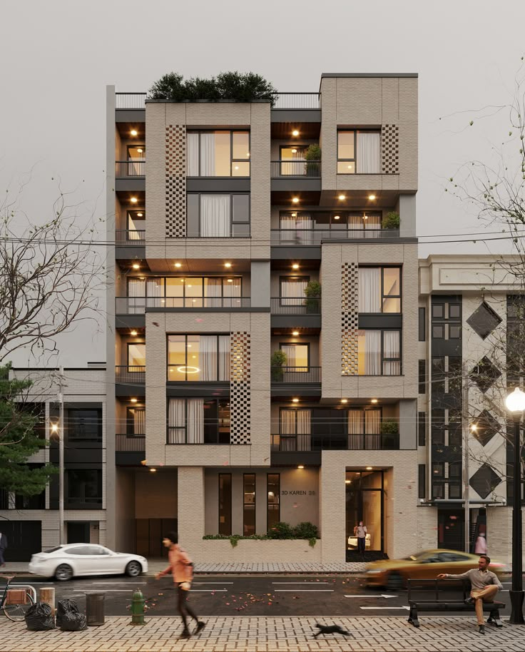 two people walking on the sidewalk in front of an apartment building with balconies