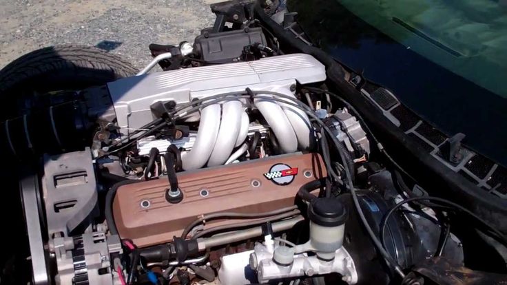 the engine compartment of a car with its hood open