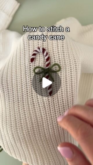 a person is holding a candy cane in a sweater with the words how to stitch a candy cane on it