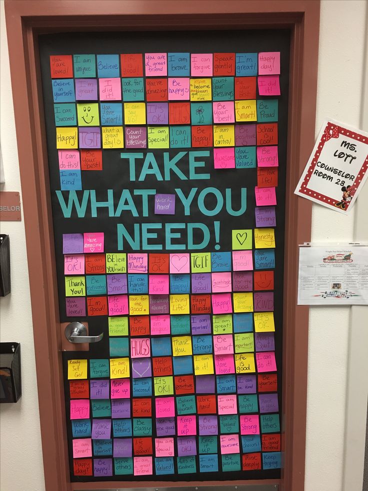 a door decorated with post it notes and the words take what you need