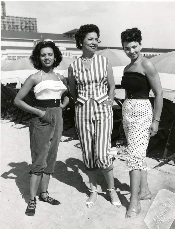 African-American women pose in Atlantic City. Chicken Bone Beach was the segregated section for African Americans on Atlantic City's beach area. Between 1900 and the early 1950s, African Americans were socially restricted to use the Missouri Avenue Beach Area. Since many vacationing Black families arrived with chicken-laden hampers, the strip became affectionately named "Chicken Bone Beach."African-American women pose in Atlantic City. Chicken Bone Beach was the segregated section for African Am 50s African American Fashion, African American 1950s Fashion Black Women, 1960s Fashion Black Women, 1950s Fashion Black Women, 50s Family, 1950s Black Women, Fascinating Womanhood, 1950s Summer, City Chicken