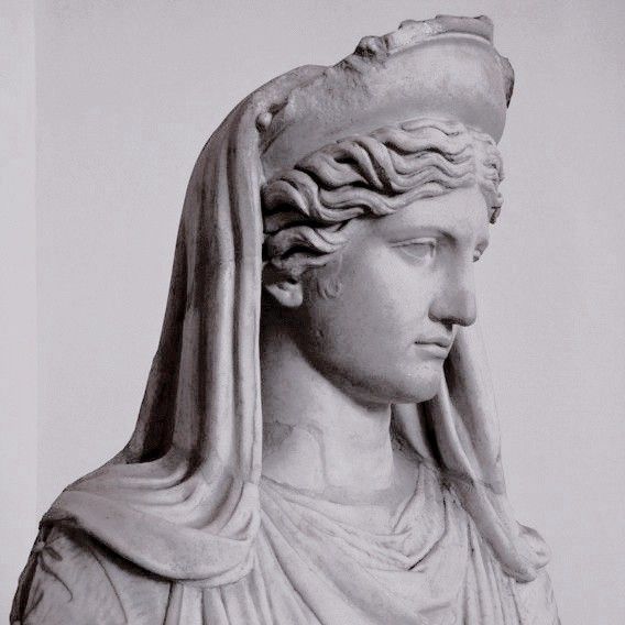 a statue of a woman with a veil on her head