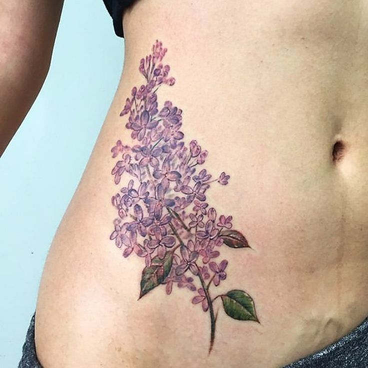 a woman's stomach with flowers on it