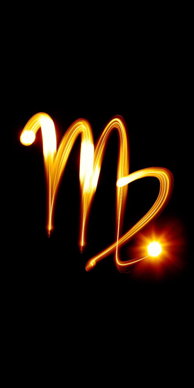 the letter m is made up of bright yellow lights and some black background with light streaks