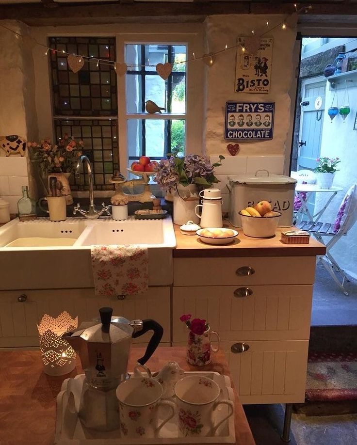 a kitchen filled with lots of dishes and cups