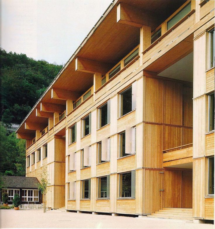 a large wooden building with many windows and balconies