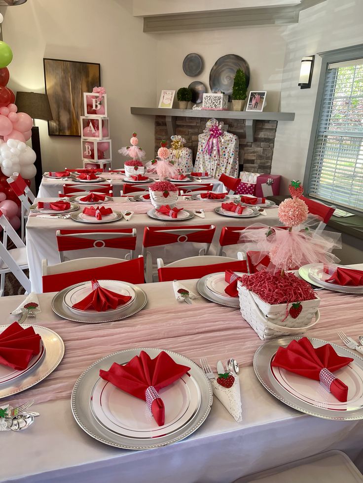 a table set up for a party with plates and napkins