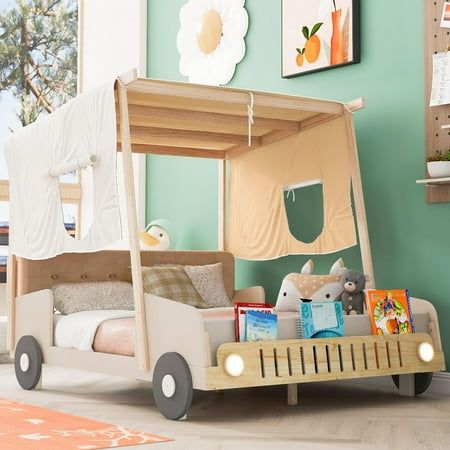 a child's bed with a tent on the top and toy cars underneath it