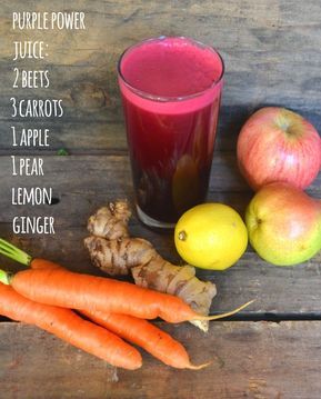 carrots, apples, lemon and ginger juice on a wooden table with the ingredients