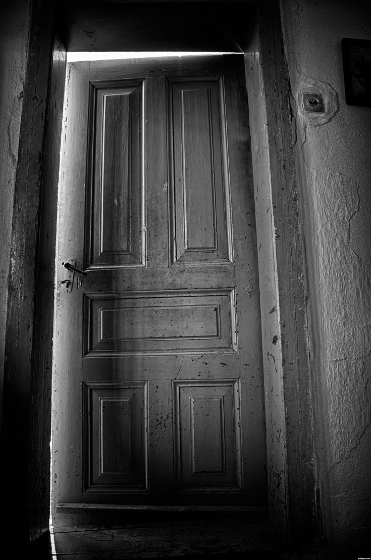 the door is open in an old building