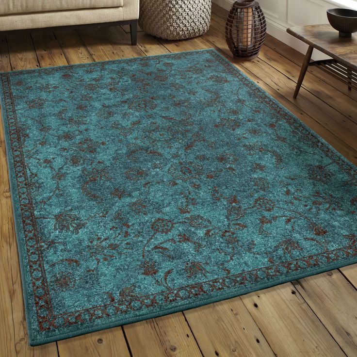 a blue area rug in a living room