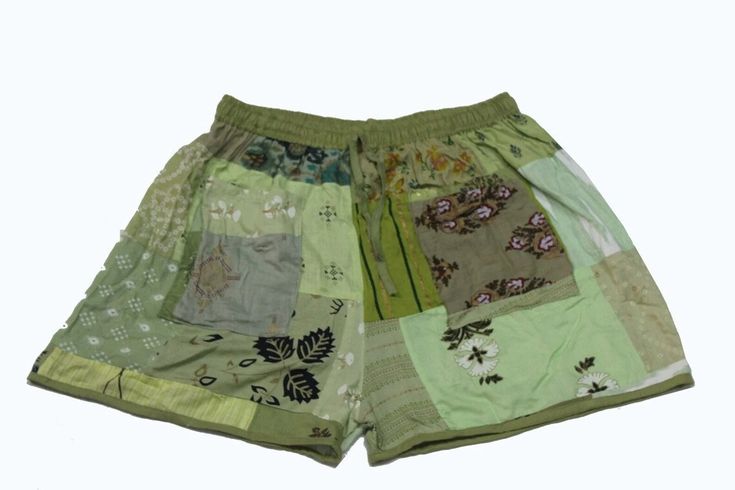 Handmade Product Assorted Patchwork Rayon Shorts, Boho Hippie Style Men And Women's Rayon Patchwork Short, Bohemian Comfortable Traveling Wear Unisex Shorts. This patchwork was made to look vintage, handmade with different patterns. It comes with cute tassels and has a comfortable elastic waist and ankle. These are made perfect for a relaxing day at home, working out, yoga. Made with soft rayon fabric. Size: (inches) Unisex Short's Waist: 20 stretching to 40" inches (elastic material) Hip: 30-46 Summer Green Shorts With Patchwork, Green Patchwork Bottoms For Vacation, Green Patchwork Bottoms For Summer, Summer Green Patchwork Bottoms, Hippie Style Men, Short Boho, Festival Mode, Home Working, Style Festival