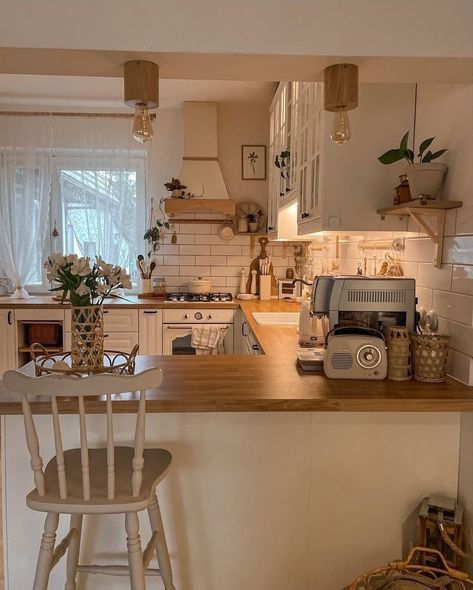 a kitchen with an island and wooden counter tops