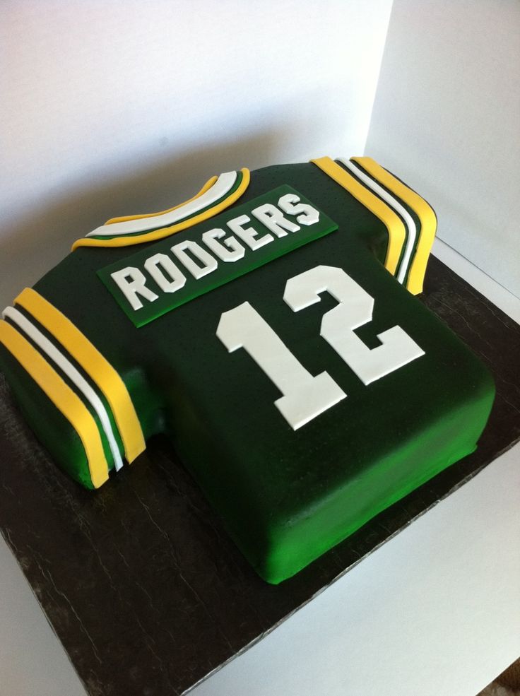 a green and yellow cake with the number 12 on it's side is shown