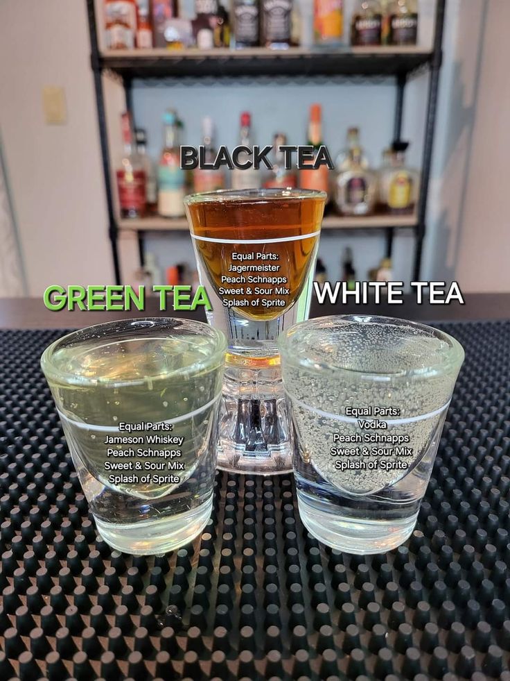 three glasses filled with different types of green tea on top of a table next to each other