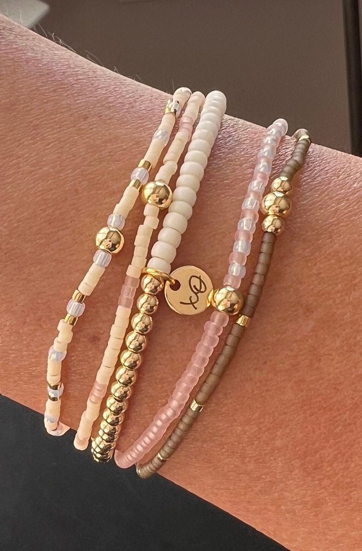 Includes 14k gold plated beads that will not tarnish. This stack also has 24k plated gold, matte cream, iridescent milky cloud, translucent pink and quartz colored beads. Made with love, XO. Neutral Bracelets, Clay Bracelet, Quartz Colors, Stackable Bracelets, Beaded Stretch Bracelet, Bracelet Stack, Gold Gold, Stretch Bracelet, Gold Beads