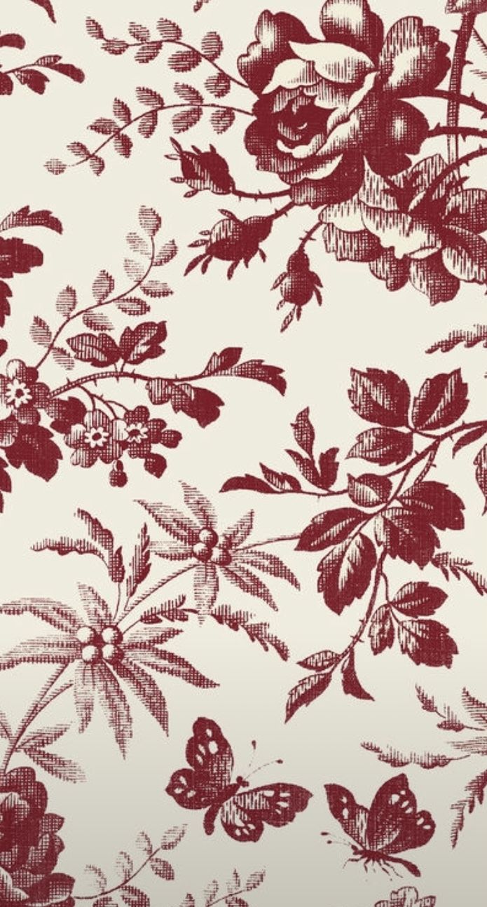 a red and white floral wallpaper with lots of flowers on it's side