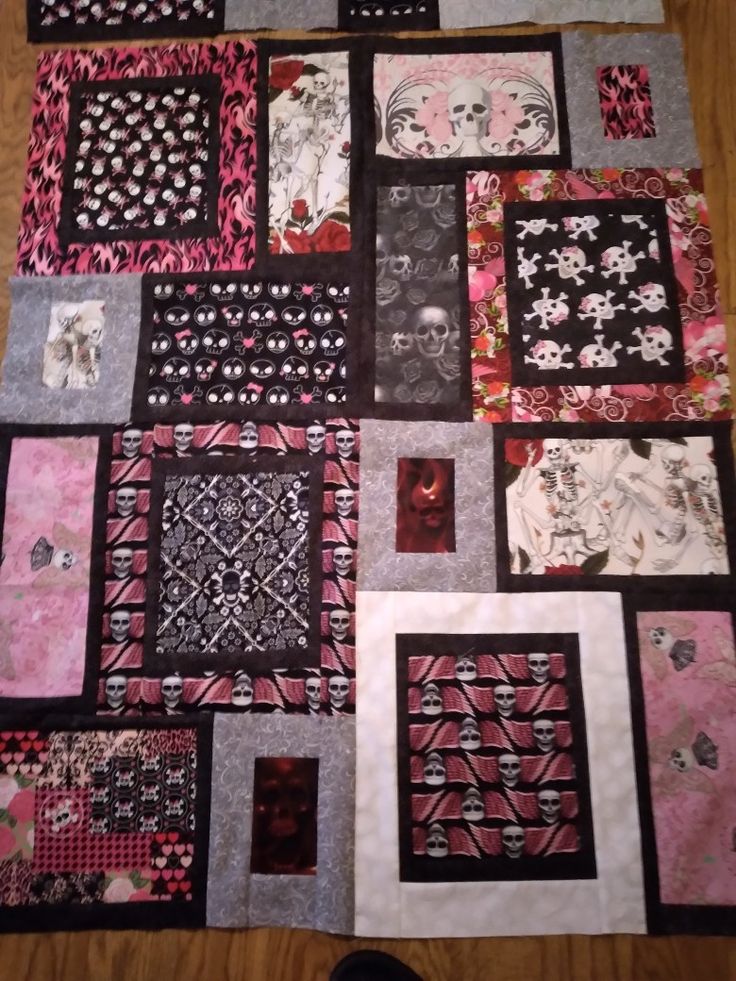 a quilted table top with many different designs on it