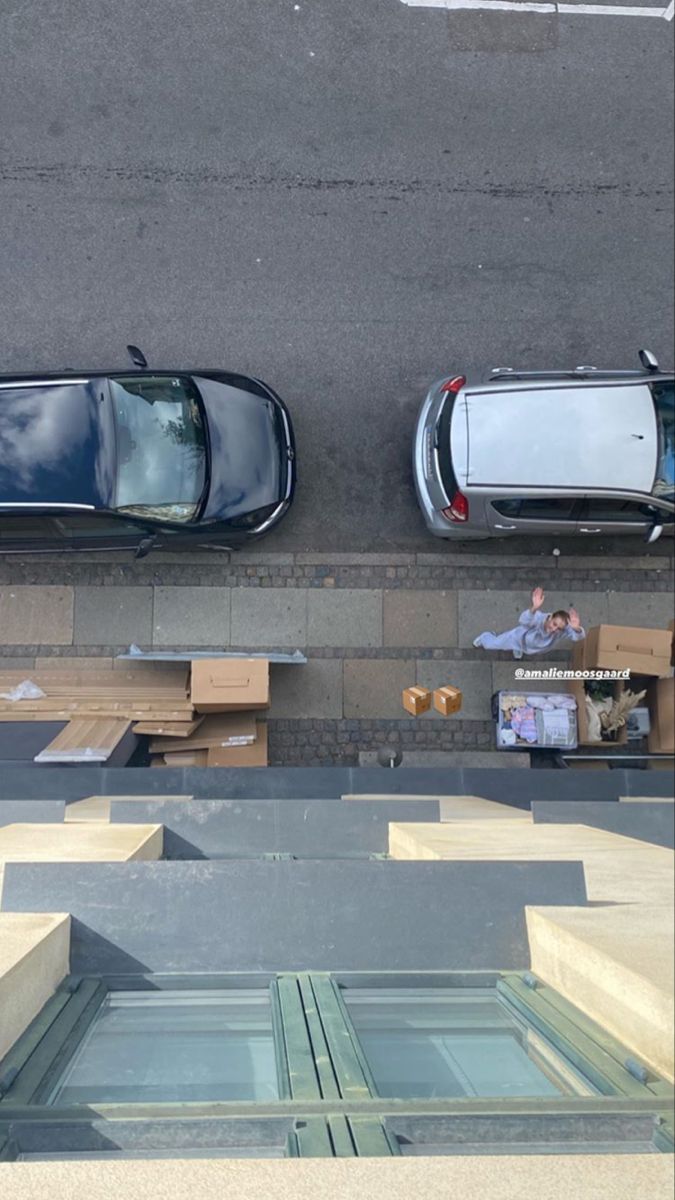 two cars parked next to each other on the street