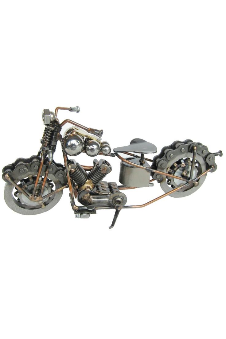 a metal model of a motorcycle on a white background