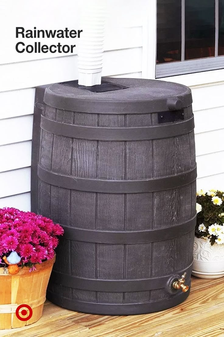 a wooden barrel sitting next to a flower pot