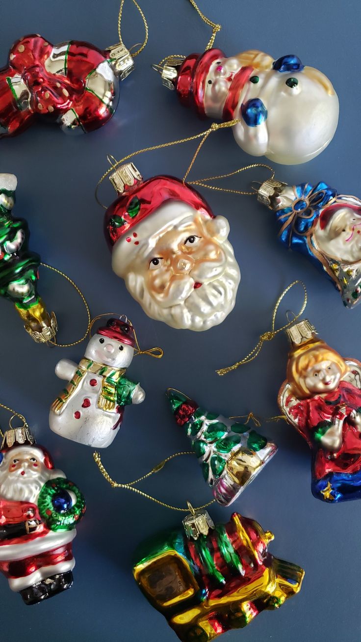 christmas ornaments are arranged on a blue surface