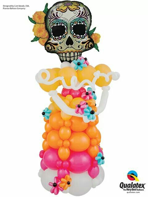 a balloon sculpture with a skull and flowers on it