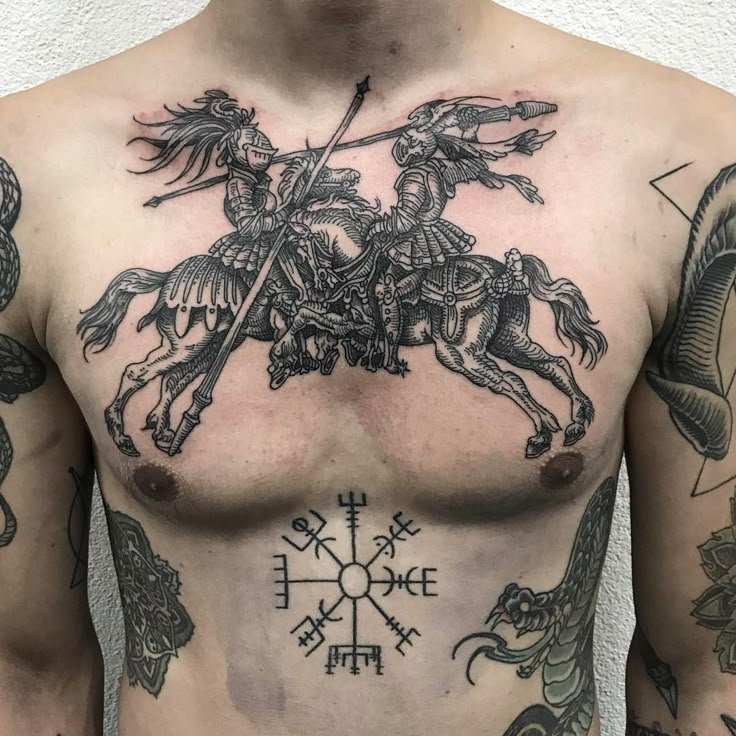 a man with tattoos on his chest has a horse and rider tattoo on his chest