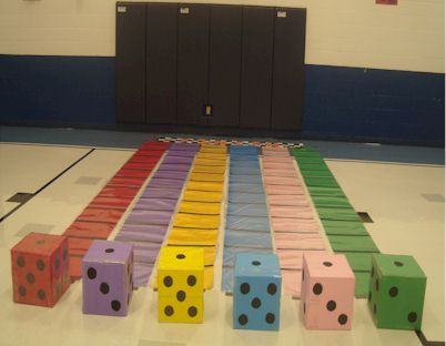 a row of colored dices sitting on top of a floor in front of lockers