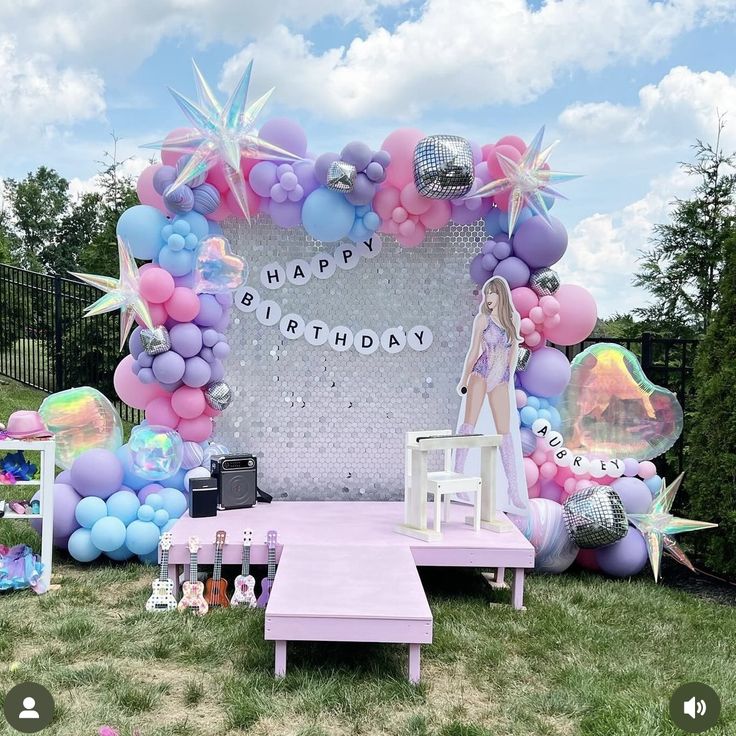 a birthday party with balloons and decorations