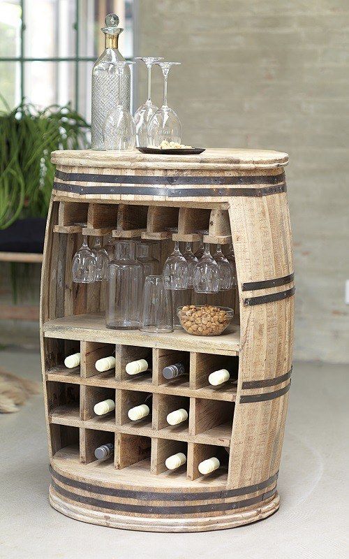 a wine rack made out of an old barrel