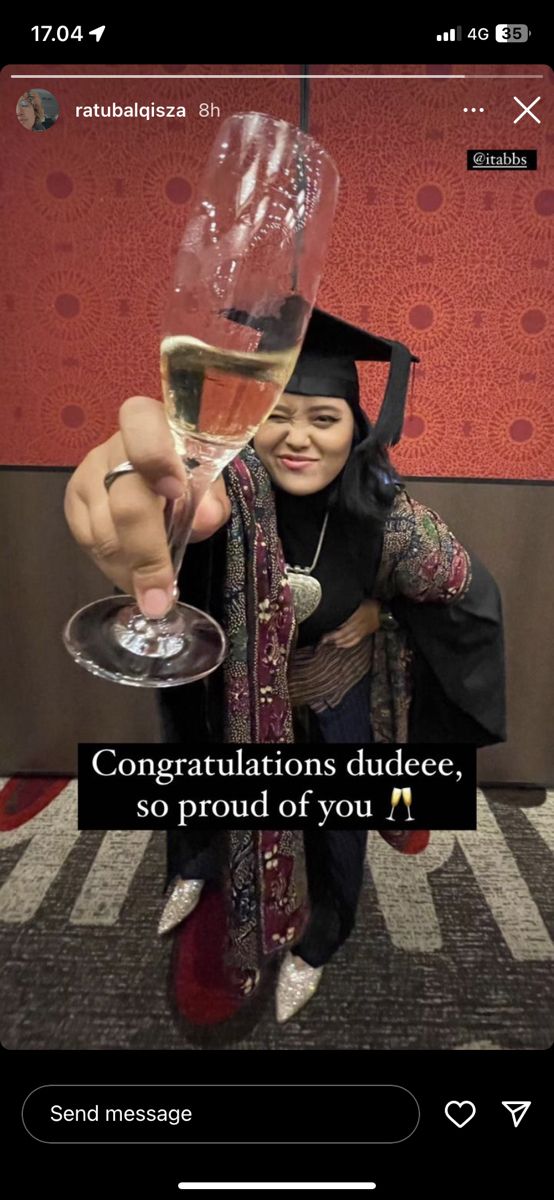 a woman holding a glass of wine in front of her face with the caption congratulations dudeee, so proud of you