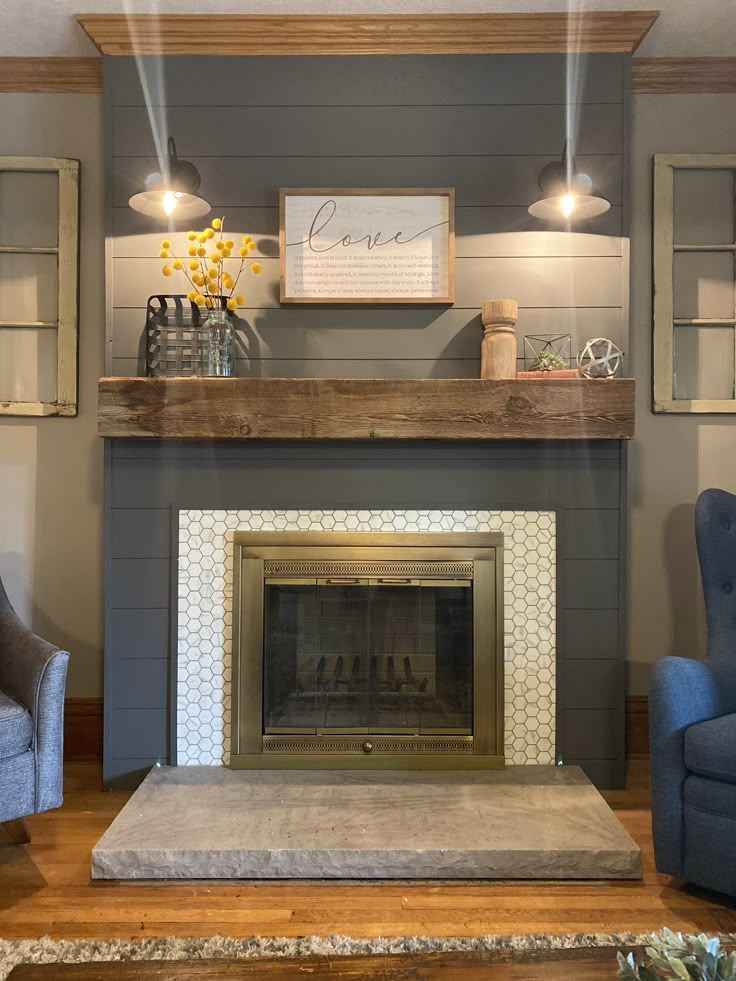 a living room filled with furniture and a fire place under a sign that says love